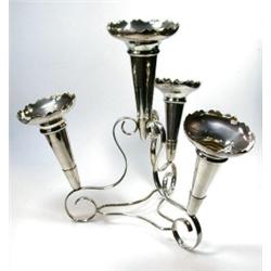 An electroplate epergne raised on a triangular flat wire frame with three small wavy edged trumpet..