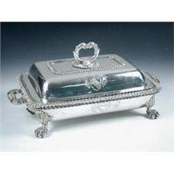 An Old Sheffield plate entree dish, cover and warmer base of rectangular form, plain with gadrooned.
