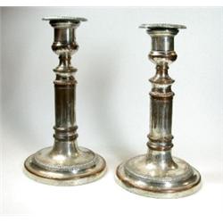 A pair of Old Sheffield plate telescopic candlesticks, each raised on a circular foot below a cylin.