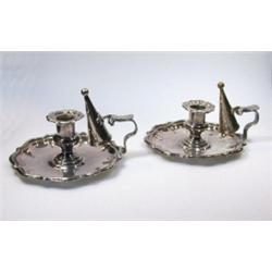 A pair of Old Sheffield plate chambersticks, probably by Padley, Parkin & Co, each on a shaped circ.
