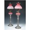Image 1 : A pair of Old Sheffield plate table candlesticks circa 1840, each raised on a lobed circular foot w.
