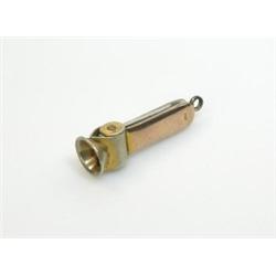 A 9ct gold mounted cigar cutter, 5cm   £40-60...
