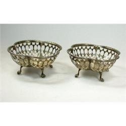 A pair of silver quatrefoil bon bon dishes by Sebastian Garrard, London 1921, the bodies decorative.