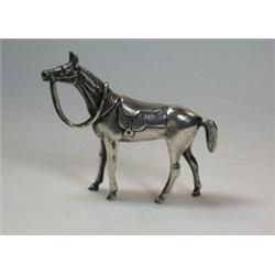 A silver figure of a saddled horse by A E Jones, Birmingham 1971, 7cm, 4.75oz    £100-150...