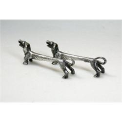 A pair of silver knife rests modelled as Dachshund dogs, maker R&D, Sheffield 1977, 8cm, 2.5oz    £.