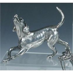A silver figure of a foxhound, maker's mark indistinct, London 1971, 6cm, 3.5oz   £100-150...