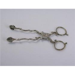 A pair of 18th century silver sugar nips, maker WP, (maker's and sterling mark only) with shell bow.