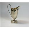 Image 1 : A silver helmet cream jug by the Haseler Bros, London 1910, the body plain below a moulded edge, ra.