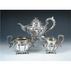 A William IV silver three piece teaset by Henry Wilkinson and Co, Sheffield 1834, comprising: a tea.
