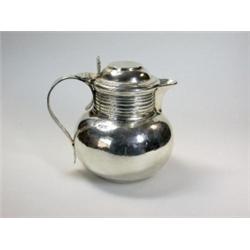 An Edwardian silver covered jug by George Perkins, London 1904, of plain baluster shape below a cyl.
