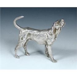 A silver figure of a foxhound baying by C J Vander, Sheffield 1976, 9.5cm, 10.5oz    £100-150...