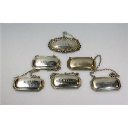 A set of five modern silver wine labels by Francis Higgins, Sheffield 1973, each of canted rectangu.