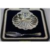 Image 1 : A silver butter shell by James Deakin & Sons, Sheffield 1918, raised on three ball feet, 8.5cm case.