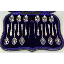 A set of twelve silver brightcut engraved teaspoons, maker JR, Sheffield 1913, cased together with..