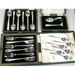 A set of six silver coffee spoons by Walker & Hall, Sheffield 1956, initialled 'H', cased; a silver.