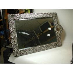 An Edwardian silver mounted dressing table mirror by H Matthews, Birmingham 1904, rectangular with..