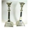 Image 1 : A pair of silver table candlesticks, maker BG & Co, Birmingham 1939, each raised on a square beaded.