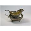 Image 1 : A George III silver cream jug, maker's mark indistinct, London 1810, of compressed rectangular shap.
