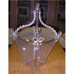 A 19th century glazed brass lantern, four foliate arms supporting the tapering square sides with cl.