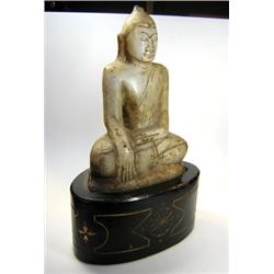 A 19th century Malaysian white marble Buddha seated cross legged on a lotus throne, one palm open i.