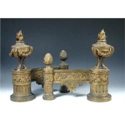 A pair of 19th century bronze doré chenets, the flambeau urn fronts on beaded, oak leaf garlanded a.