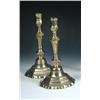 Image 1 : A pair of late 18th century French brass candlesticks, the octagonal nozzles above baluster stems w.