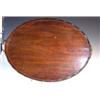 Image 1 : A 19th century mahogany tray, brass handles at each end of the wavy gallery above the oval tray, 67.