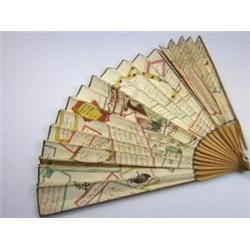 An early 19th century fan, the paper leaf printed and hand coloured with mottoes, riddles, music an.