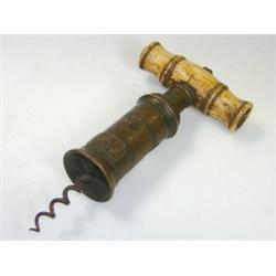 A 19th century corkscrew of Thomasson type, the turned bone handle, once with brush to one end, ele.