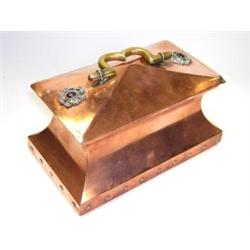 An Arts and Crafts copper casket, the rectangular lid applied with rosettes of paste jewels either..