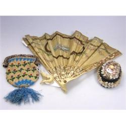 A 19th century fan, the silk leaf painted with musical trophy and on bone sticks, a beadwork purse,.