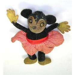 A 1930's Dean's Rag Book Minnie the Mouse, the soft toy wears a white poker dot dress and has metal.