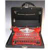 Image 1 : A black leatherette cased red Corona portable typewriter, the qwerty keyboard above the label 'LC S.
