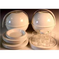 Two 1960's Guzzini white plastic spherical picnic baskets containing plates, bowls, beakers, storag.