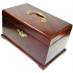 An 18th century and later mahogany box, the rectangular lid with brass carrying handle, the interio.
