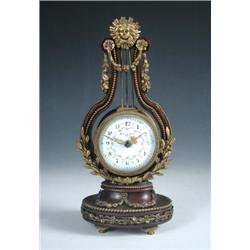 'Maple and Co Ltd Paris', a brass mounted mahogany lyre clock, the eight day movement with platform.