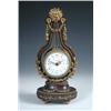 Image 1 : 'Maple and Co Ltd Paris', a brass mounted mahogany lyre clock, the eight day movement with platform.