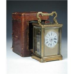 'R & Co. Made in Paris', a striking and repeating carriage clock in brass obis case, the dial ename.