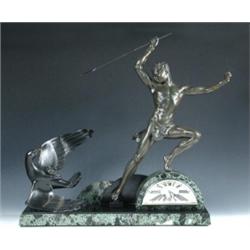 J De Roncourt, an Art Deco spelter and green variegated marble clock garniture, the eight day pendu.