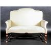 Image 1 : An 18th century style walnut framed settee, the arched padded back above scrolling arms and overstu.