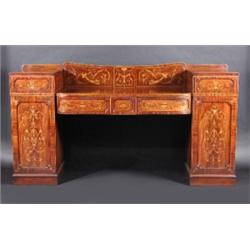An early 19th century mahogany pedestal sideboard, the marquetry inlaid arched back above a bow fro.