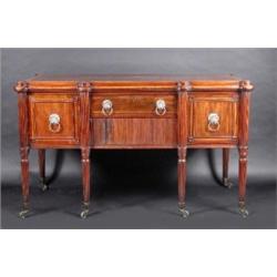 A Regency mahogany sideboard stamped Gillow, the satinwood banded moulded shaped top above a frieze.
