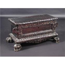 A continental carved oak cassone, the rectangular rising top with carved edge above a carved panell.