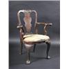 Image 1 : An early 18th century walnut open armchair, the carved arched top rail above a solid vase shaped sp.