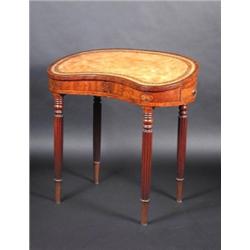 A 19th century mahogany kidney shape writing table, the leather inset shaped top above a marquetry..