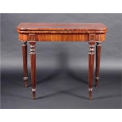 A Regency mahogany tea table, the rounded rectangular fold over top above a plain frieze supported..