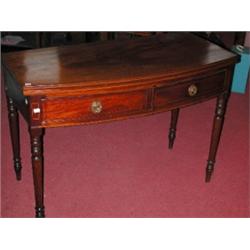 A 19th century mahogany bowfront tea table, the shaped line inlaid fold over top above a pair of fr.