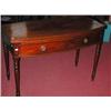 Image 1 : A 19th century mahogany bowfront tea table, the shaped line inlaid fold over top above a pair of fr.