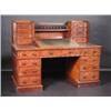 Image 1 : A Victorian mahogany Dickens desk, the spindle turned back above a single shelf flanked with short..