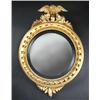 Image 1 : A Regency gilt framed convex wall glass, the circular plate within an ebonised slip and abacus fram.